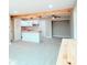 Bright open-concept kitchen and living space with light wood beams and a butcher block kitchen island at 5546 Marilyn Rd, Indianapolis, IN 46226