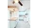 Bright, white kitchen with a butcher block island, white cabinetry, subway tile backsplash, and modern lighting at 5546 Marilyn Rd, Indianapolis, IN 46226