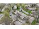 An aerial view of townhomes in a neighborhood surrounded by mature trees at 5762 Overcrest Dr, Indianapolis, IN 46237