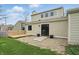 This backyard features a wood deck, sliding glass doors, and a stone patio area at 5762 Overcrest Dr, Indianapolis, IN 46237