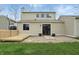 This backyard features a wood deck, sliding glass doors, and a stone patio area at 5762 Overcrest Dr, Indianapolis, IN 46237