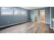 This bedroom features wood-look floors and an ensuite bathroom with a tiled shower at 5762 Overcrest Dr, Indianapolis, IN 46237