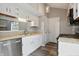 Updated kitchen features white cabinetry, stainless steel appliances, and durable countertops at 5762 Overcrest Dr, Indianapolis, IN 46237