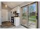 Bright kitchen with stainless appliances and sliding glass door to the yard at 5762 Overcrest Dr, Indianapolis, IN 46237