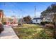 Relaxing backyard featuring a charming patio, mature trees, and a storage shed at 6225 Indianola Ave, Indianapolis, IN 46220