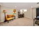 Versatile finished basement space featuring new carpet, recessed lighting, and a seating area with comfortable decor at 6225 Indianola Ave, Indianapolis, IN 46220