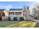 Charming home featuring a stone facade, covered porch, well-maintained landscaping, and a cozy curb appeal at 6225 Indianola Ave, Indianapolis, IN 46220