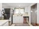 Clean kitchen featuring white cabinetry, stainless appliances, and a window over the sink at 6225 Indianola Ave, Indianapolis, IN 46220