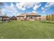 Well-maintained backyard featuring a deck and large lawn at 6459 Canak Dr, Avon, IN 46123