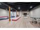 Finished basement featuring an open space with a play area and wood-look flooring at 6459 Canak Dr, Avon, IN 46123