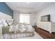 Comfortable bedroom with a bed, a dresser, neutral decor, and a window at 6459 Canak Dr, Avon, IN 46123