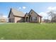 Beautiful brick home with an attached three-car garage, spacious lawn, and a charming gazebo at 6459 Canak Dr, Avon, IN 46123