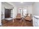 Inviting foyer featuring hardwood floors, neutral walls, and a front door with decorative glass at 6459 Canak Dr, Avon, IN 46123