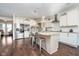 Spacious kitchen featuring an island with granite countertops, stainless steel appliances, and dark wood flooring at 6459 Canak Dr, Avon, IN 46123