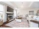 Comfortable living room featuring a fireplace, recessed lighting, and hardwood flooring at 6459 Canak Dr, Avon, IN 46123
