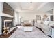 Bright living room featuring hardwood floors, fireplace, neutral colors, and an open floor plan at 6459 Canak Dr, Avon, IN 46123
