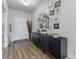 Inviting foyer features modern decor, hardwood floors, and a gallery wall of framed photos at 6922 Kara Ln, Brownsburg, IN 46112