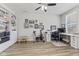 Versatile office space with built-in shelving, desk, and workout area with natural light at 6922 Kara Ln, Brownsburg, IN 46112