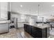 Modern kitchen with an island and barstools, stainless appliances, and an open layout at 6922 Kara Ln, Brownsburg, IN 46112