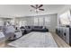 Spacious living area with neutral tones, large windows, and an open layout to the kitchen at 6922 Kara Ln, Brownsburg, IN 46112