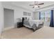 Spacious main bedroom suite with a tray ceiling, neutral colors, and a luxurious feel at 6922 Kara Ln, Brownsburg, IN 46112