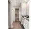 Bathroom showcasing a walk-in shower, double sink vanity, and a view into the walk-in closet at 7397 Standish Ln, Avon, IN 46123