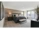 Spacious bedroom with a king bed, wood accent wall, and lots of natural light at 7397 Standish Ln, Avon, IN 46123