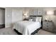 This bedroom features neutral decor, closet, and a large, plush bed at 7397 Standish Ln, Avon, IN 46123