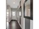 Contemporary hallway with dark wood floors, fresh paint, and decorative mirrors at 7397 Standish Ln, Avon, IN 46123