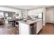 Beautiful kitchen with an island, stainless steel appliances, and hardwood floors throughout the home at 7397 Standish Ln, Avon, IN 46123