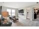 Living room area with a large couch and entertainment center at 7397 Standish Ln, Avon, IN 46123
