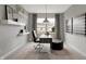 Cozy study with a desk, chair, ottoman, large window, and modern shelving at 7397 Standish Ln, Avon, IN 46123