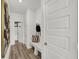 Entryway with a bench, coat hooks, and wood flooring at 7516 Fallsworth Dr, Avon, IN 46123