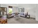 Bright living room with modern decor, a large window, and a comfortable sectional sofa at 7516 Fallsworth Dr, Avon, IN 46123