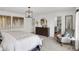 Comfortable main bedroom with neutral tones and a sitting area, filled with natural light at 7516 Fallsworth Dr, Avon, IN 46123