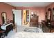 Bright bedroom features warm-toned walls, a comfortable bed, and traditional wooden furnishings at 7682 Micawber Ct, Indianapolis, IN 46256