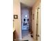 Hallway features a view to bathroom, carpet flooring, and decor at 7682 Micawber Ct, Indianapolis, IN 46256