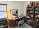 Office featuring wooden desk, bookshelf, and an abundance of storage and decor at 7682 Micawber Ct, Indianapolis, IN 46256