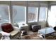 Bright sunroom featuring wicker furniture, ample natural light, and a relaxing atmosphere at 7682 Micawber Ct, Indianapolis, IN 46256