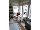 Cozy sunroom with wicker seating, tiled floors, and plenty of natural light at 7682 Micawber Ct, Indianapolis, IN 46256