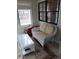 Inviting sunroom with wicker furniture, bright windows, and a cozy, relaxed ambiance at 7682 Micawber Ct, Indianapolis, IN 46256