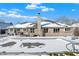 Backyard featuring a brick house and a pool covered in snow beneath a bright blue sky at 8329 Hill Gail Dr, Indianapolis, IN 46217
