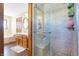 Bathroom featuring a shower with a built-in bench and wood vanity at 8329 Hill Gail Dr, Indianapolis, IN 46217