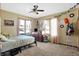 Bedroom featuring a ceiling fan, and large windows that fill the room with natural light at 8329 Hill Gail Dr, Indianapolis, IN 46217