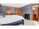 Bedroom featuring carpet, a bed, and an ensuite bathroom with well-lit vanity at 8329 Hill Gail Dr, Indianapolis, IN 46217