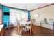 Breakfast area with wood floors, large windows, and a table with chairs at 8329 Hill Gail Dr, Indianapolis, IN 46217