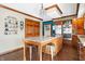 Spacious kitchen features wood cabinets, stainless steel appliances, granite countertops, and island with seating at 8329 Hill Gail Dr, Indianapolis, IN 46217
