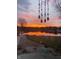 Tranquil lake view at sunset, showcasing vibrant colors reflected in the calm water at 8329 Hill Gail Dr, Indianapolis, IN 46217