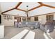 Spacious living room featuring beamed ceilings, a cozy fireplace, and comfortable seating with ample natural light at 8329 Hill Gail Dr, Indianapolis, IN 46217