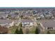 An aerial view of the home showcasing the backyard, patio, surrounding neighborhood, and local pond at 10264 Normandy Way, Fishers, IN 46040